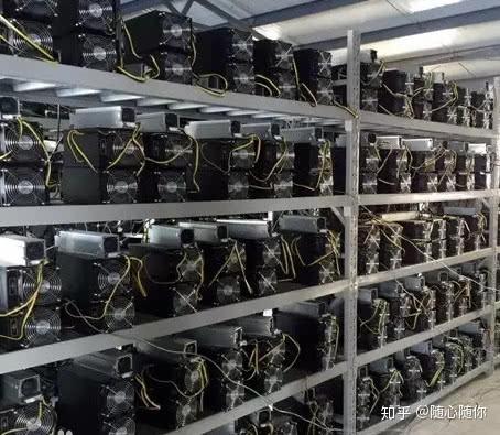 A technician inspecting the components of a mining rig